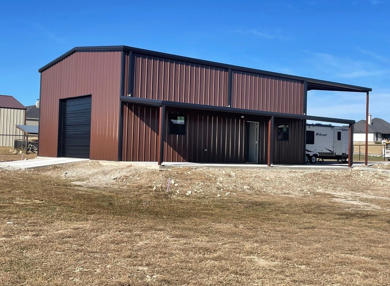 Custom metal building with RV cover by Jaybird Construction