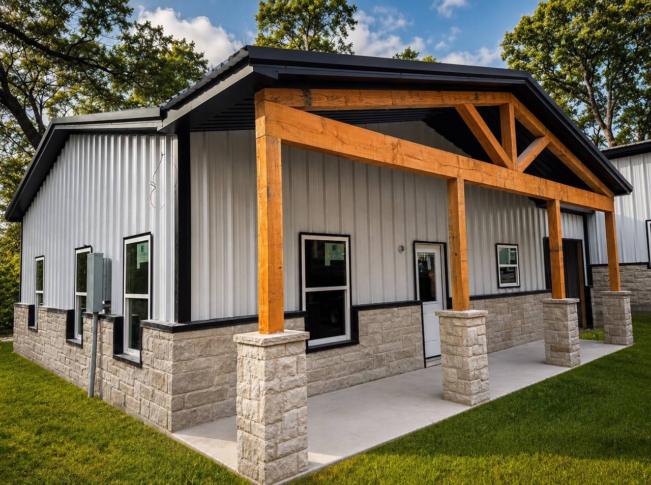 Residential metal building with stone wainscot and cedar truss porch